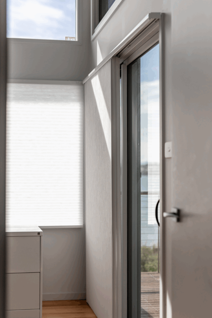 Sliding Thermacell blind used as a room divider in this large open plan space.