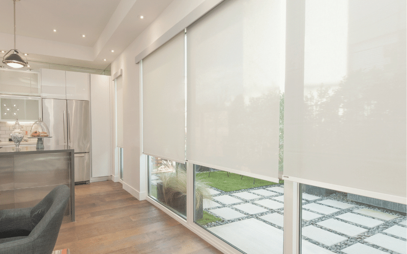 Bright open plan kitchen with light filtering kitchen blinds.