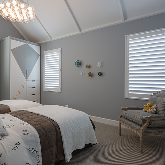Kids bedroom with large shutters windows