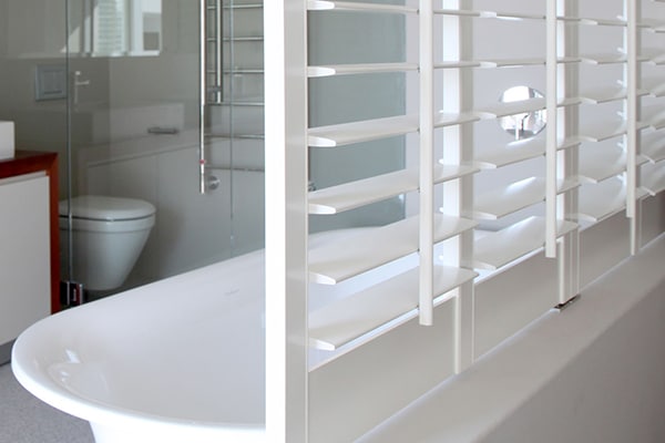 Woodlore waterproof shutter beside bath